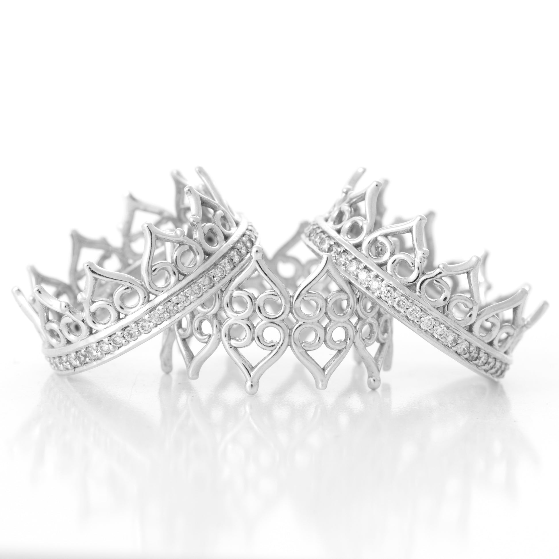 Three separate hoop rings, made of 18k white gold and set with diamonds